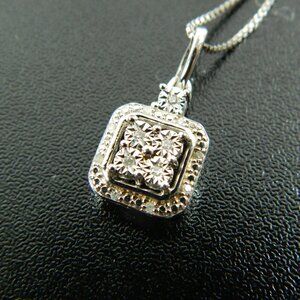 Diamond Blossom Necklace Diamonds set in Sterling Silver appx 1/20ctw